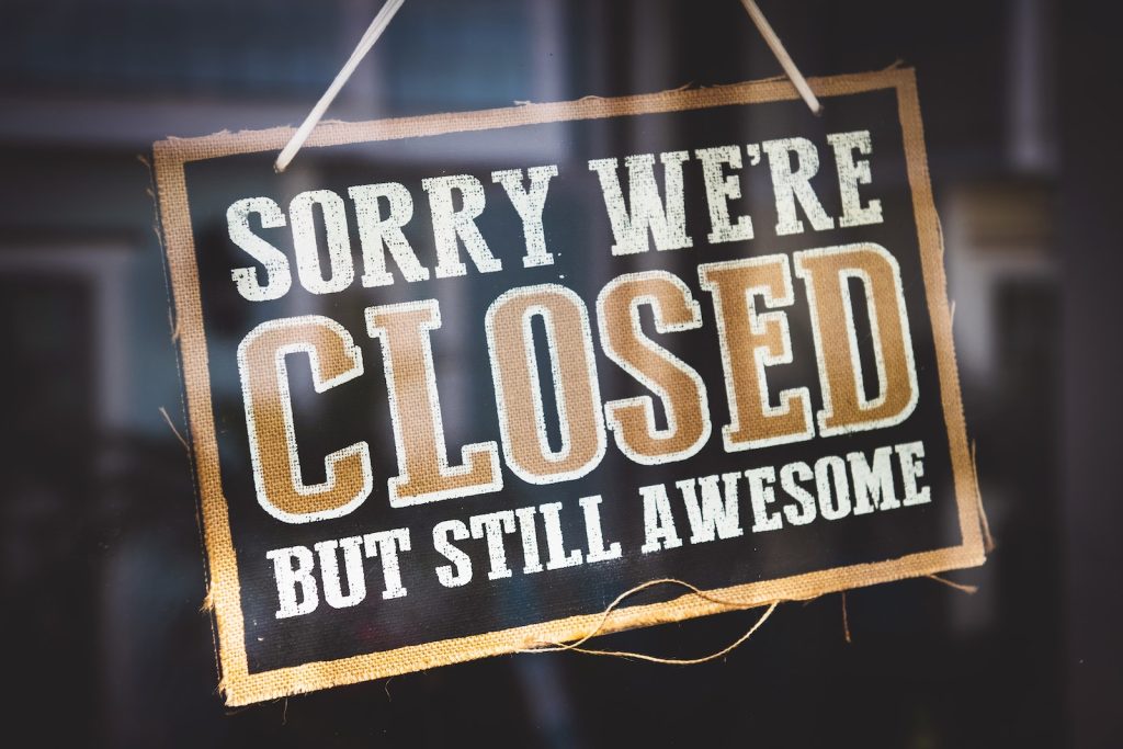 Sorry We're Closed but Still Awesome Sign, on a store window.