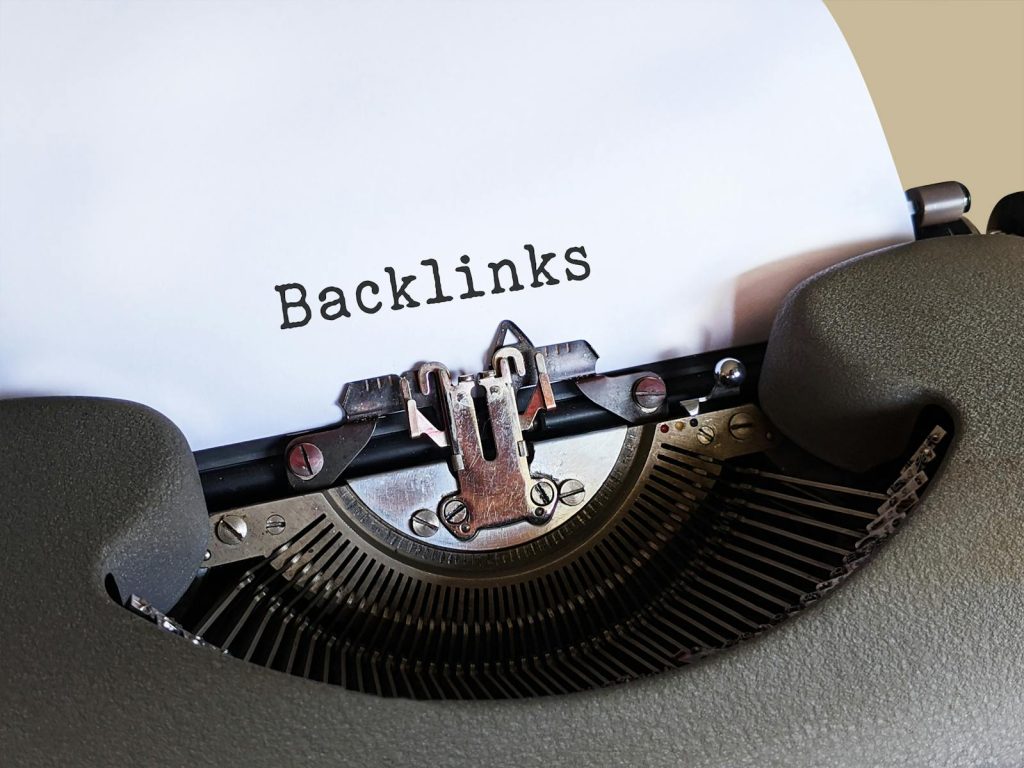 Gray Typewriter with White Paper, "Backlinks"