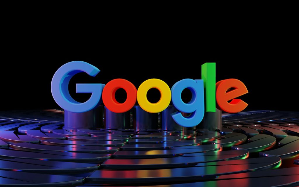 the google logo is displayed in front of a black background